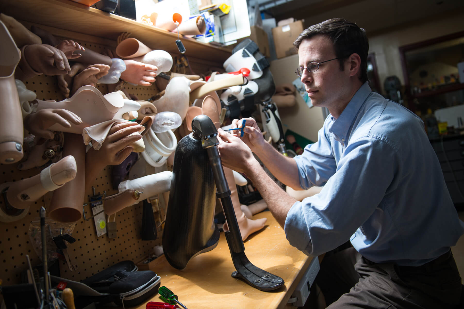 Researcher working on prosthetic limbs.