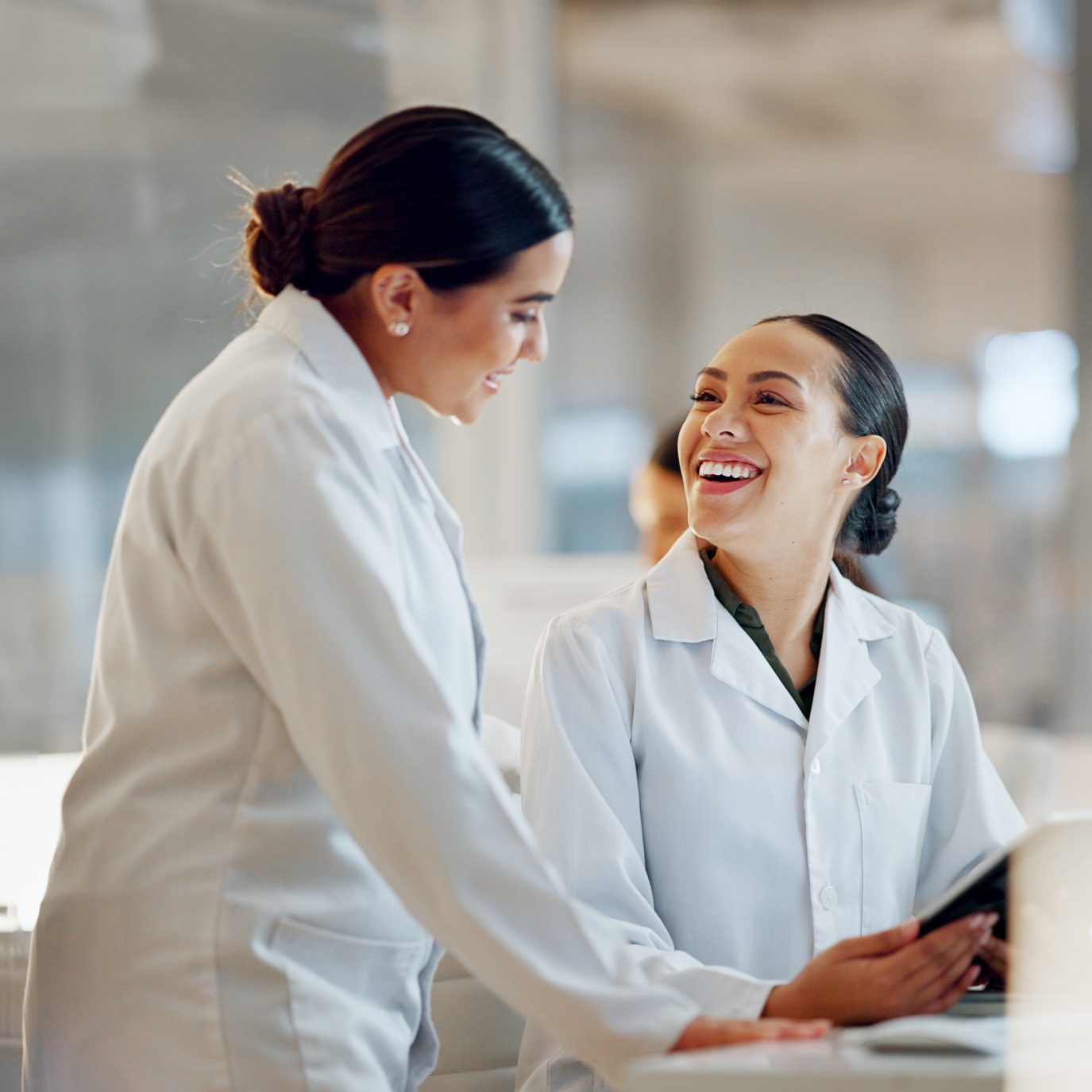 Scientist, women and teamwork on tablet and computer for laboratory advice, medical research and night planning. Students, science people or mentor on digital technology of test results or comparison.